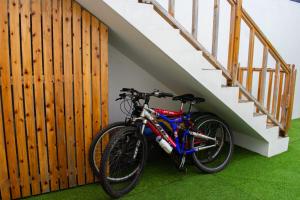 a bike is parked next to a staircase at Domus Nostra in Furnas