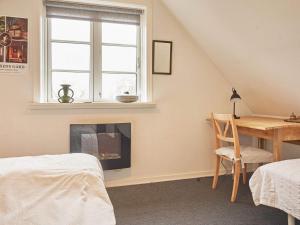 Postel nebo postele na pokoji v ubytování Holiday home Aakirkeby IX