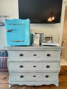 a dresser with a blue box on top of it at 5 stars in Eastover in Charlotte