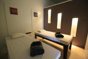 Ένα ή περισσότερα κρεβάτια σε δωμάτιο στο T Shine Resort and Spa