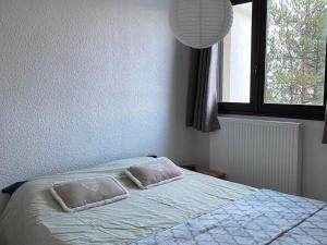 Posteľ alebo postele v izbe v ubytovaní Appart 50m2 à Villard-de-Lans, 6 pers, 2 ch, balcon, ascenseur - FR-1-515-143