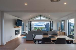 a living room with a couch and a table at La Cachette Wanaka in Wanaka