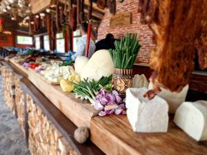 a display of vegetables on a counter in a store at Hotel Miruna in Sîmbăta de Sus