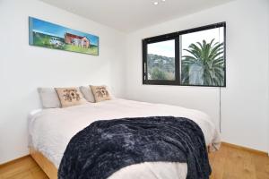 Postelja oz. postelje v sobi nastanitve Esplanade Beach House - Christchurch Holiday Homes