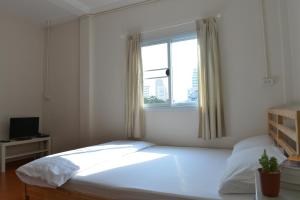 Postel nebo postele na pokoji v ubytování PanPan Hostel