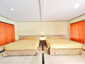 Ein Bett oder Betten in einem Zimmer der Unterkunft Bromo Permai 1