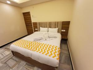 Postel nebo postele na pokoji v ubytování GT Grande Hotel-Near US Consulate