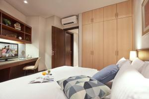 Somerset Bencoolen Singapore客房内的一张或多张床位