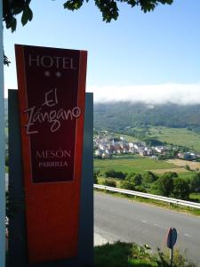 a sign for a hotel on the side of a road at Hotel Parrilla el Zangano in Boal