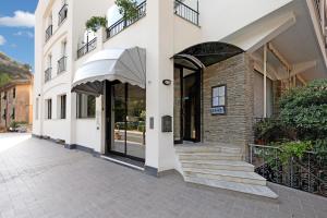 a building with a staircase in front of it at 13 Mehari in Varigotti