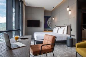 A television and/or entertainment centre at Pullman Tbilisi Axis Towers