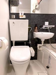 a bathroom with a toilet and a sink at Hotel Prezier Akihabara - Vacation STAY 21812v in Tokyo