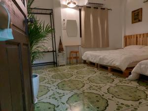Postel nebo postele na pokoji v ubytování JENI Homestay โฮมสเตย์หลังใหญ่ปิ้งย่างได้ + 15 fotografií
