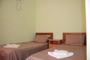 Postel nebo postele na pokoji v ubytování Hotel Premium