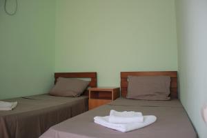 Postel nebo postele na pokoji v ubytování Hotel Premium