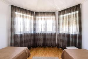 Posteľ alebo postele v izbe v ubytovaní Vila Curic