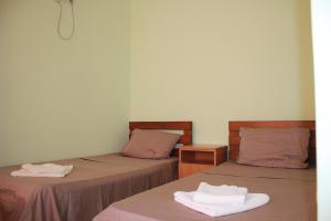 Postel nebo postele na pokoji v ubytování Hotel Premium