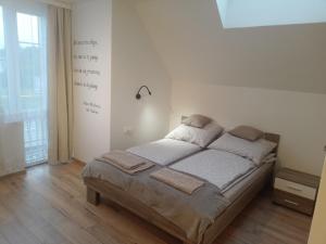 a bedroom with a large bed in a room at Pensjonat Mickiewicz in Sandomierz