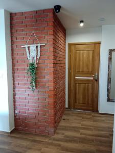 a brick wall with a basketball hoop hanging on it at Pensjonat Mickiewicz in Sandomierz