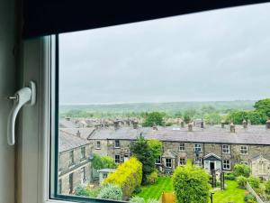 a view from a window of a town at Burley Apartment in Burley in Wharfedale