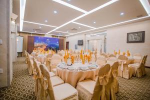 A television and/or entertainment centre at Minh Toan Athena Hotel