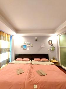 Кровать или кровати в номере SINH ĐÔI HOUSE