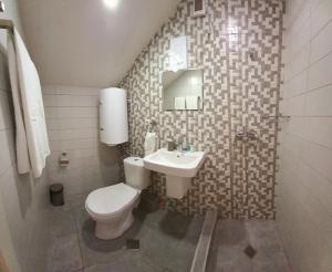 Koupelna v ubytování Hotel Lile