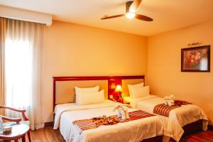 A bed or beds in a room at Minh Toan Athena Hotel