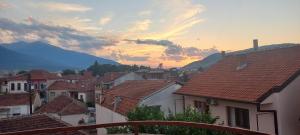 a view of a town with houses and mountains at Happiness Apartment Center in Bitola