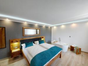 Posteľ alebo postele v izbe v ubytovaní Etno Boutique