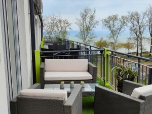 A balcony or terrace at Beachfront Paradise Ezüst Panoráma lakeview apartment with panoramic terrace