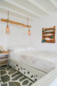 Postel nebo postele na pokoji v ubytování Fisherman's Syrma House