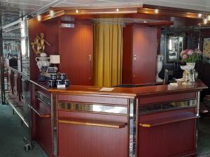 a room with a wooden counter in a room at River hotel KÖNIGSTEIN in Prague