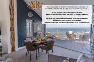 a flyer for a beach house with a table and chairs at No.1 The Prom in Westward Ho