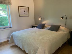 Un pat sau paturi într-o cameră la Åre Travel - Brygghusen