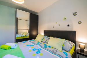Posteľ alebo postele v izbe v ubytovaní Phoenix Apartman Siófok