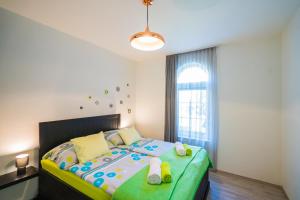 Posteľ alebo postele v izbe v ubytovaní Phoenix Apartman Siófok