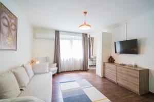Televízia a/alebo spoločenská miestnosť v ubytovaní Phoenix Apartman Siófok