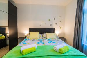 Posteľ alebo postele v izbe v ubytovaní Phoenix Apartman Siófok