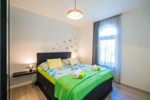 Posteľ alebo postele v izbe v ubytovaní Phoenix Apartman Siófok