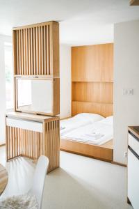 Un pat sau paturi într-o cameră la PINOT HOUSE Mikulov