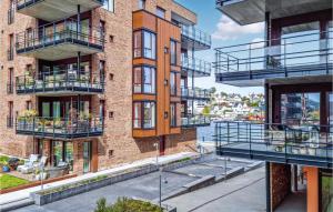 una imagen de un edificio de apartamentos con balcones en Nice Apartment In Kristiansand With Wifi And 2 Bedrooms en Kristiansand