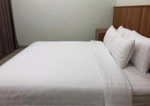 Postel nebo postele na pokoji v ubytování OmahKoe Homes