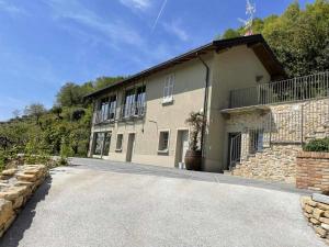 a large house with a driveway in front of it at Cascina Pianetta Quinta in Missaglia