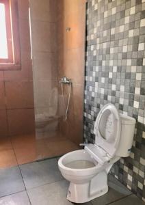 Koupelna v ubytování OmahKoe Homes + 13 fotografií