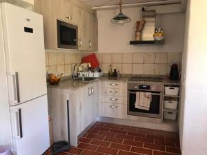 Kuchyňa alebo kuchynka v ubytovaní Cal Tató Apartament