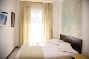 Postel nebo postele na pokoji v ubytování Elite Hotel