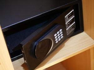 a microwave oven sitting on top of a shelf at West Lerruat Hotel in Nairobi