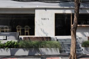 a view of a restaurant with tables and chairs at The Cotton Saladaeng Hotel in Bangkok