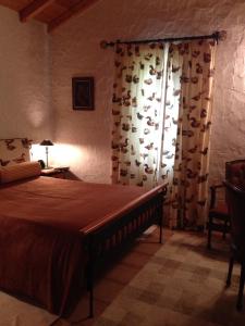 Ένα ή περισσότερα κρεβάτια σε δωμάτιο στο Moinho do Comandante